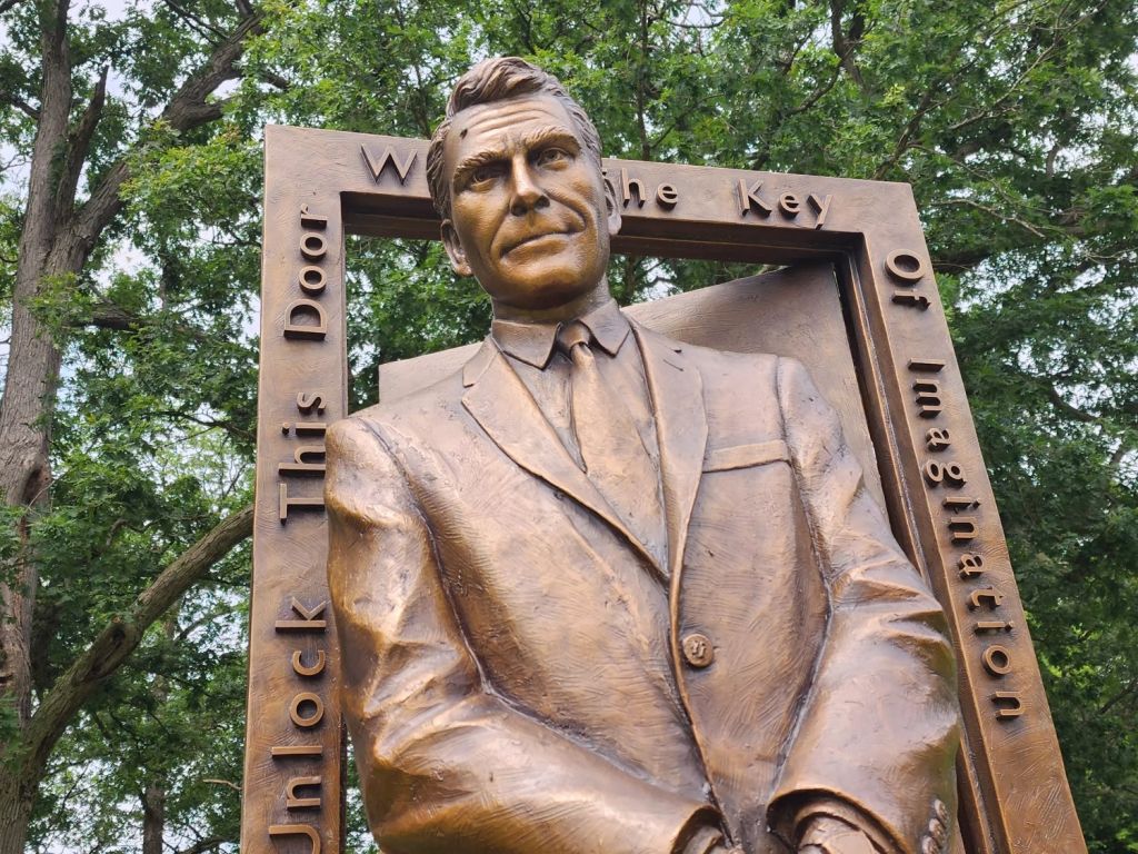 Close view of the finished Rod Serling bronze portrait and Twilight Zone doorway inscription