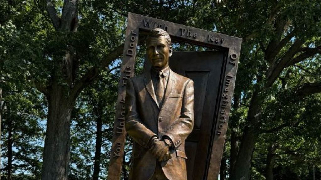 Completed six-foot Rod Serling bronze statue standing within a sculpted doorway at Recreation Park in Binghamton