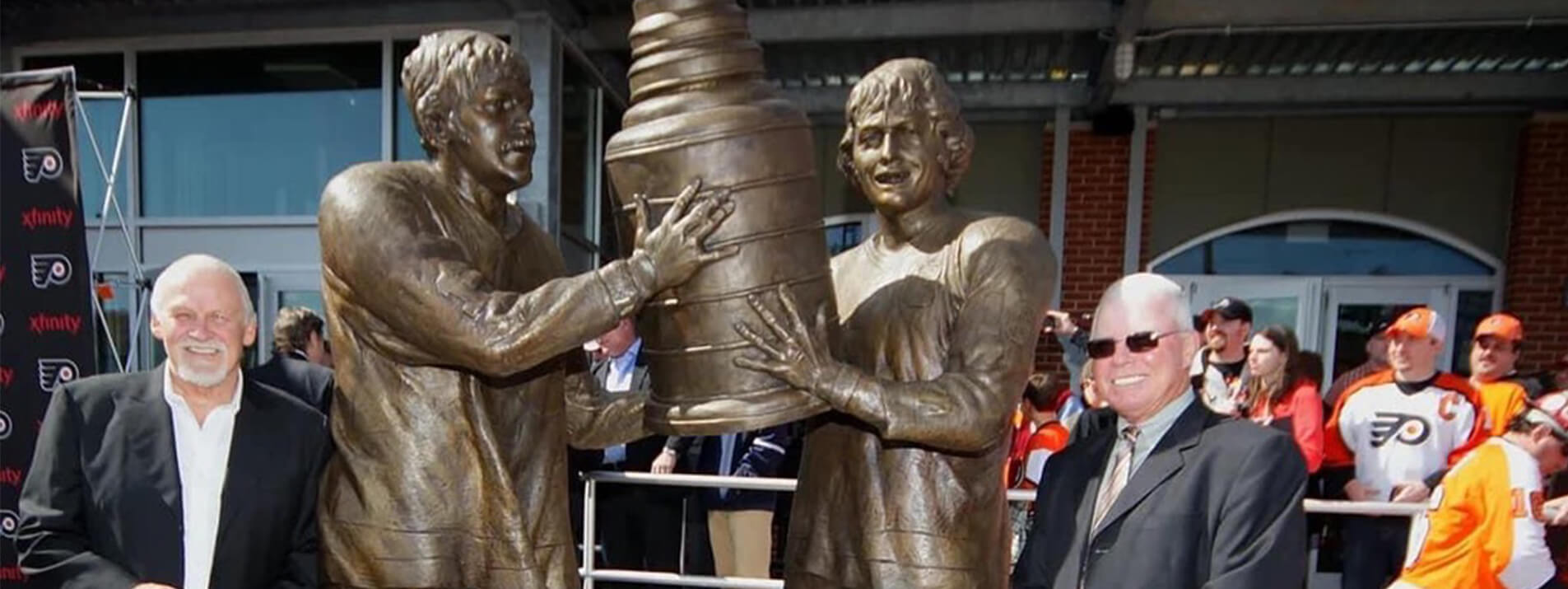 Custom bronze statues | Philadelphia Flyers bronze statue of players lifting the Stanley Cup during unveiling ceremony.